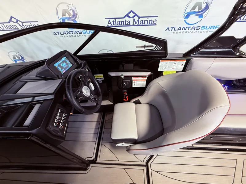Slide: The Image of Interior of a 2019 Moomba Craz boat with steering console. - 26