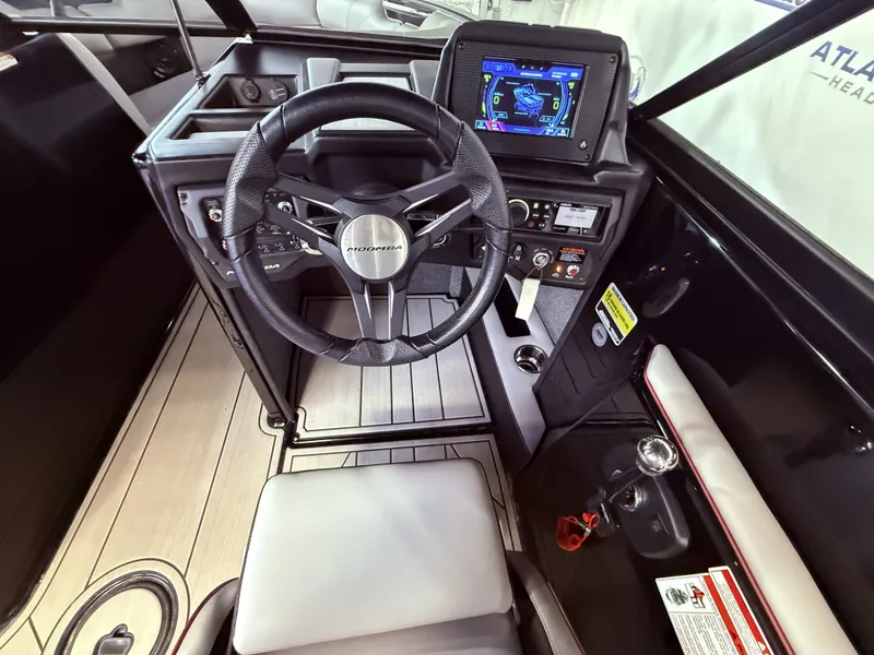 Slide: The Image of Interior of a 2019 Moomba Craz with steering wheel and control console. - 27