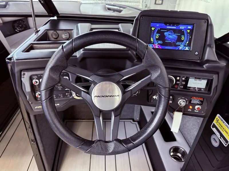 Slide: The Image of Interior view of 2019 Moomba Craz boat cockpit with steering wheel and display. - 28