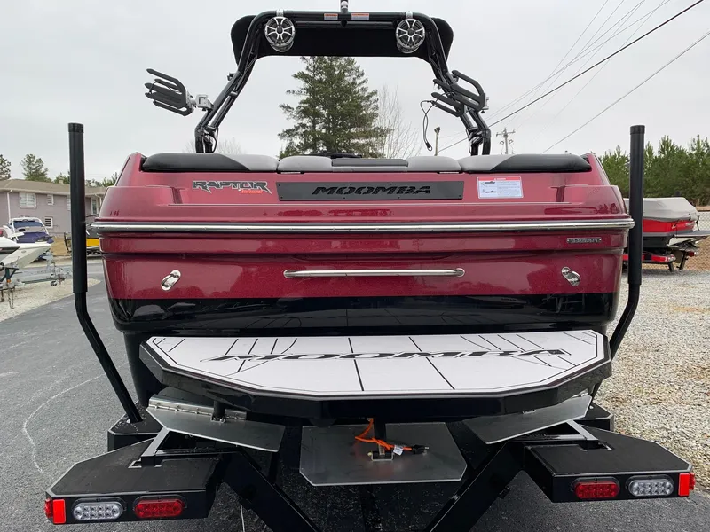 Slide: The Image of 2019 Moomba Craz boat rear view, featuring Raptor engine and wakeboard tower. - 5