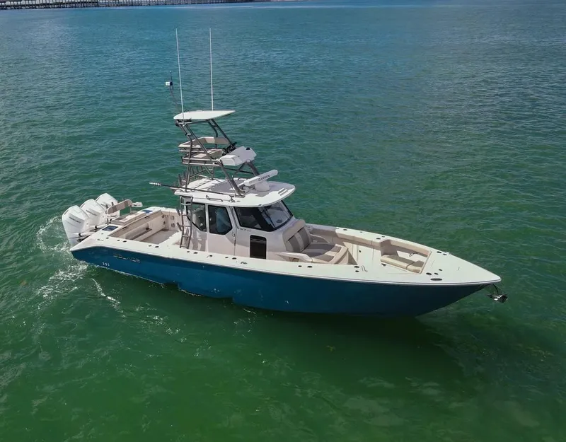 Slide: The Image of 2025 Solace 37 CS boat cruising on clear green water. - 1