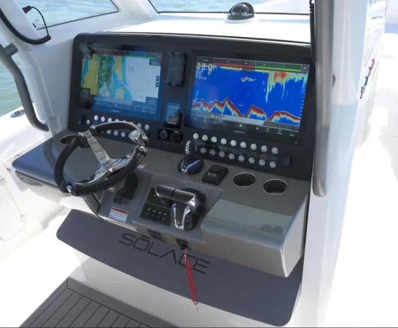 Slide: The Image of 2024 Solace 37 CS boat dashboard with advanced navigation and control systems. - 14
