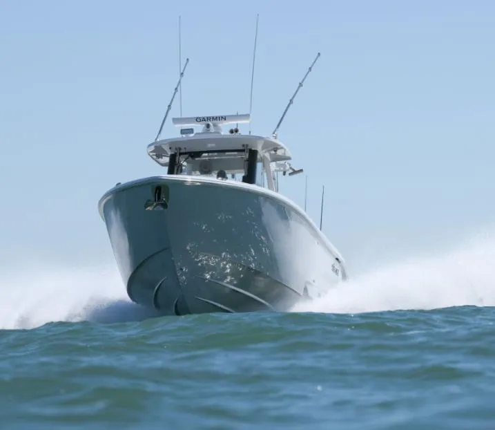 Slide: The Image of 2024 Solace 37 CS boat cruising swiftly on open water. - 17