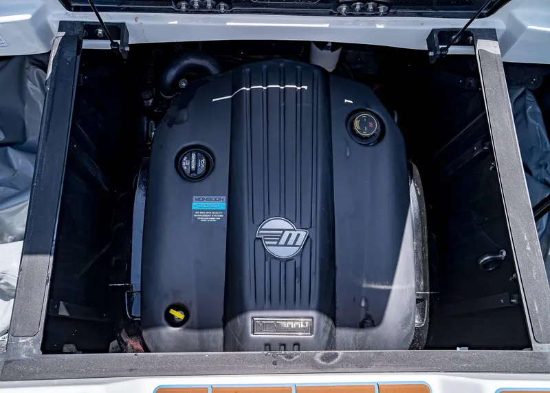 Slide: The Image of 2024 Malibu Wakesetter 24 MXZ engine compartment showcasing Monsoon engine. - 17