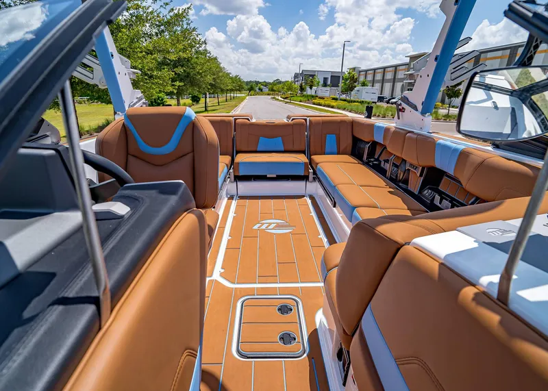 Slide: The Image of 2024 Malibu Wakesetter 24 MXZ interior with luxurious seating and modern design. - 29