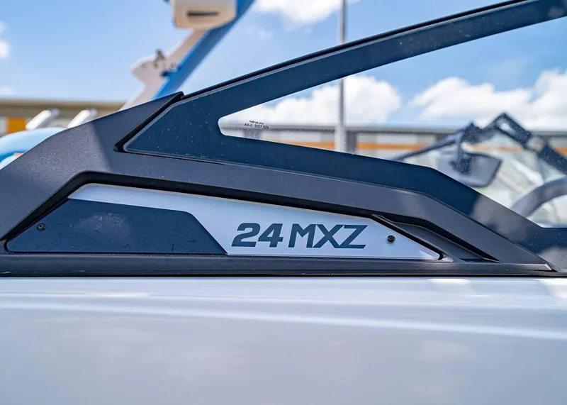 Slide: The Image of 2024 Malibu Wakesetter 24 MXZ boat detail with sleek design elements. - 3