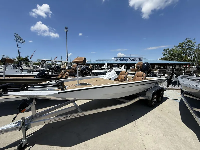 Slide: The Image of 2025 Xpress Hyper-Lift Bass Series boat on trailer at Ashley Marine dealership. - 1