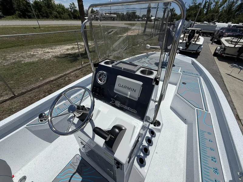 Slide: The Image of 2025 Xpress Hyper-Lift Series H22B boat with Garmin navigation system and sleek console design. - 5