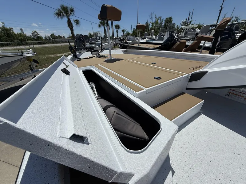 Slide: The Image of 2025 Xpress Hyper-Lift Bass Series boat with open storage compartment, showcasing sleek design. - 3