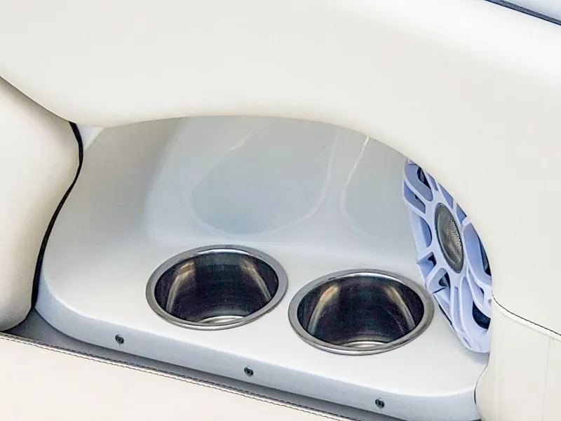 Slide: The Image of Cup holders and speaker on 2025 Stingray 211 DC boat interior. - 15