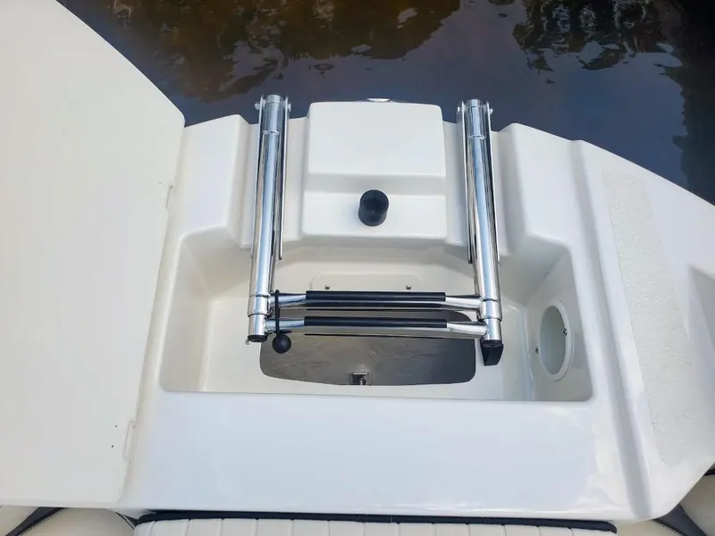 Slide: The Image of 2025 Stingray 211 DC boat swim platform with ladder, viewed from above. - 8