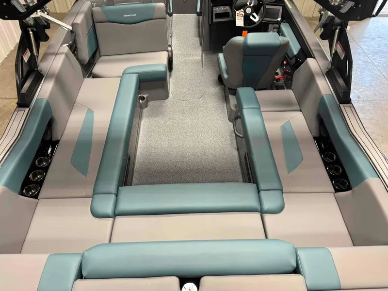 Slide: The Image of 2025 MasterCraft NXT24 boat interior with spacious seating and modern design. - 8