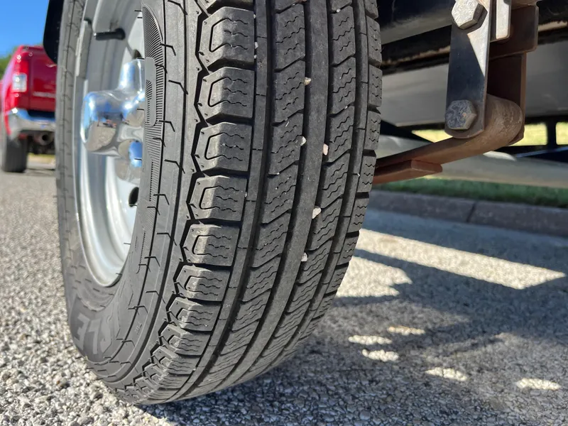 Slide: The Image of Close-up of a 2012 Tracker Pro Team 175 TXW trailer tire on asphalt. - 19