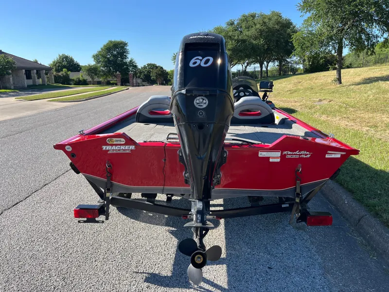 Slide: The Image of 2012 Tracker Pro Team 175 TXW boat with 60 HP engine on a sunny street. - 21