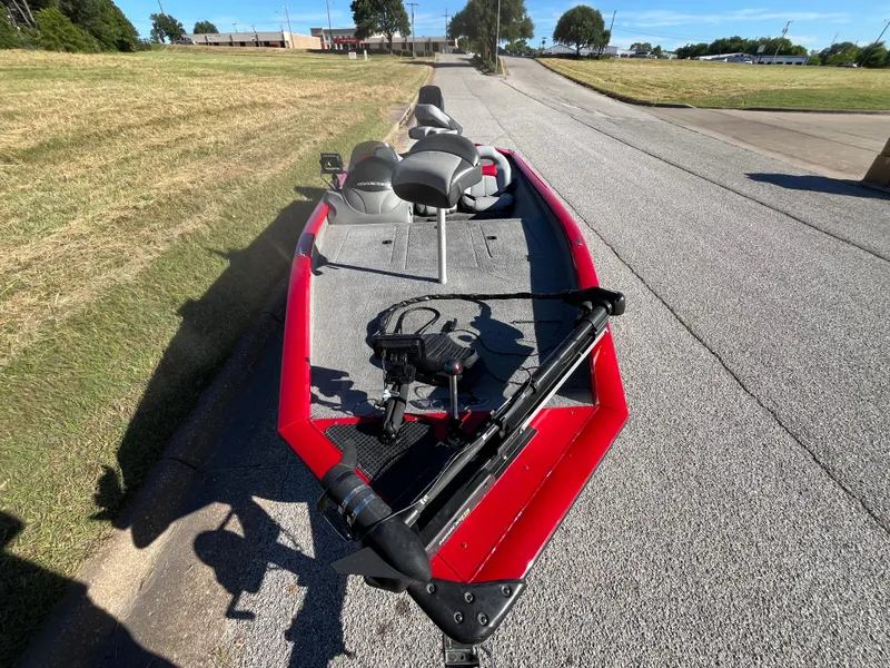 Slide: The Image of 2012 Tracker Pro Team 175 TXW boat on a sunny road, red exterior. - 23