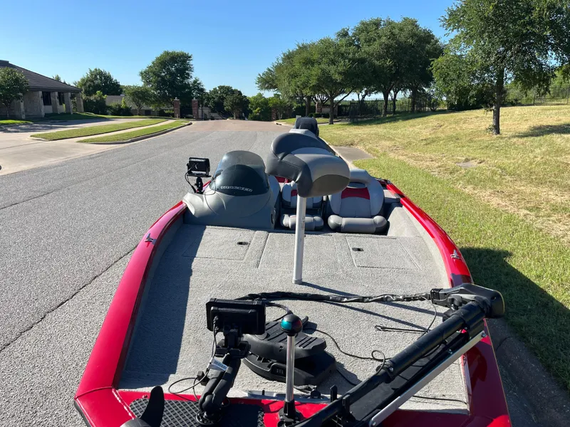 Slide: The Image of 2012 Tracker Pro Team 175 TXW boat on suburban street, red and gray design. - 25