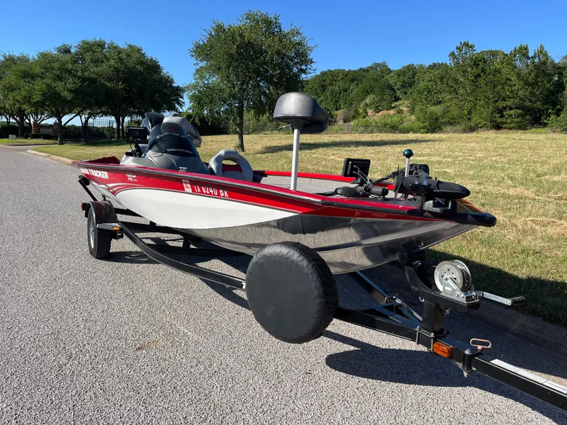 Slide: The Image of 2012 Tracker Pro Team 175 TXW boat on trailer, parked on a sunny road. - 29