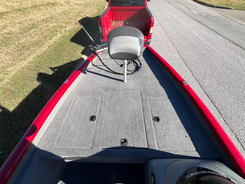 Slide: The Image of 2012 Tracker Pro Team 175 TXW boat on trailer, red exterior, gray interior, parked on roadside. - 43