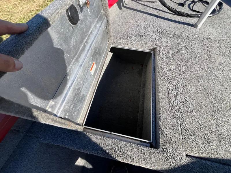 Slide: The Image of Open storage compartment on 2012 Tracker Pro Team 175 TXW boat deck. - 44