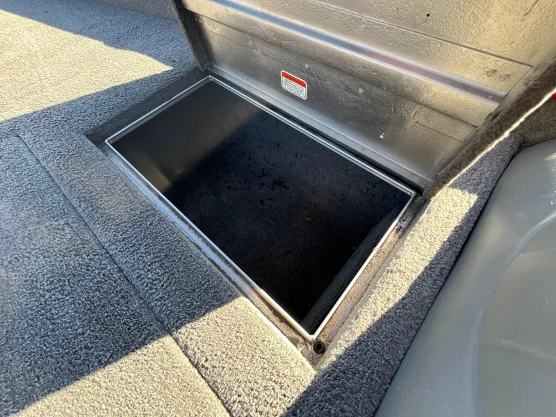 Slide: The Image of Open storage compartment in 2012 Tracker Pro Team 175 TXW boat. - 46