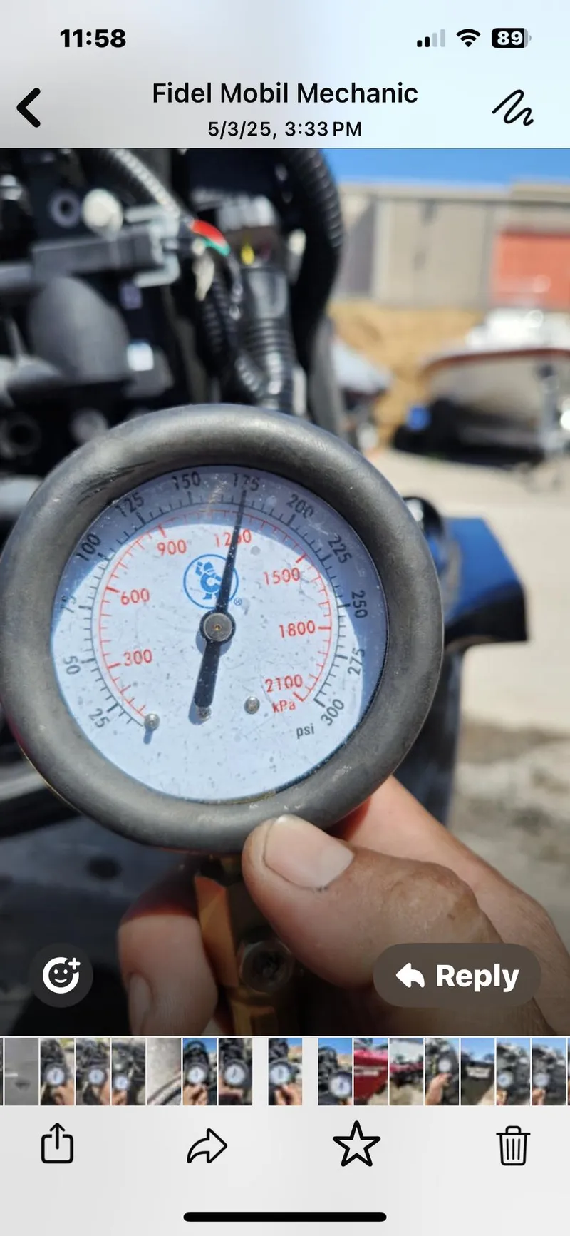 Slide: The Image of Close-up of a pressure gauge held by a hand, outdoors, near a Tracker Pro Team 175 TXW boat. - 5