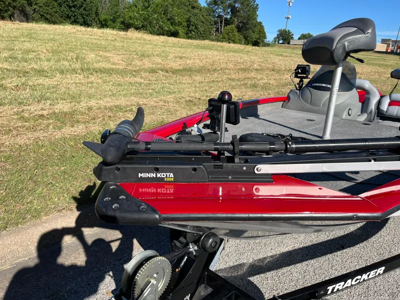 Slide: The Image of 2012 Tracker Pro Team 175 TXW boat with Minn Kota trolling motor on grassy area. - 9