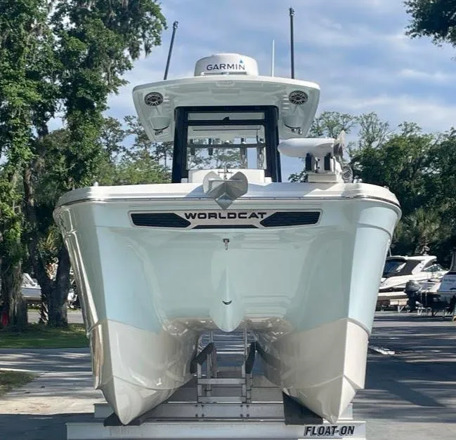 Slide: The Image of 2023 World Cat 260 CC-X boat on trailer, front view, outdoors. - 1