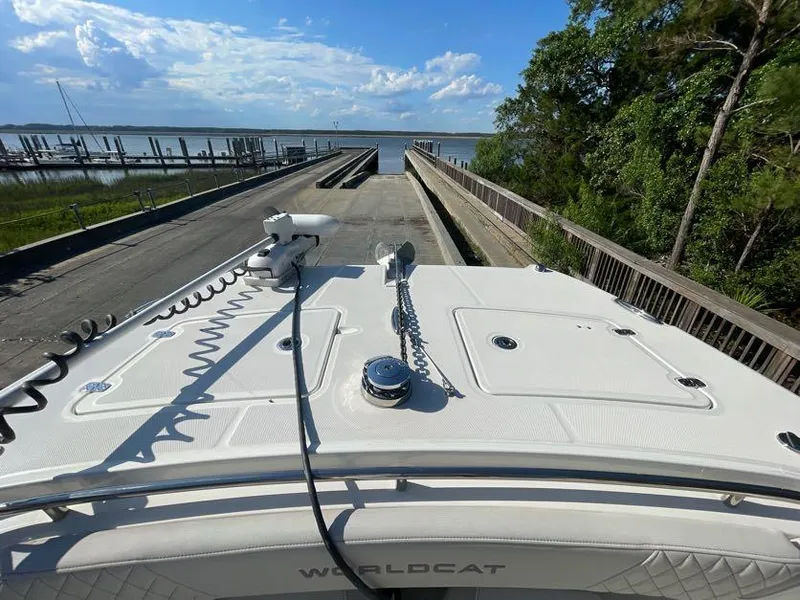 Slide: The Image of 2023 World Cat 260 CC-X boat at a dock with scenic water view. - 12