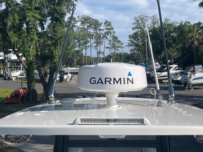Slide: The Image of 2023 World Cat 260 CC-X boat with Garmin radar, docked in a marina. - 14