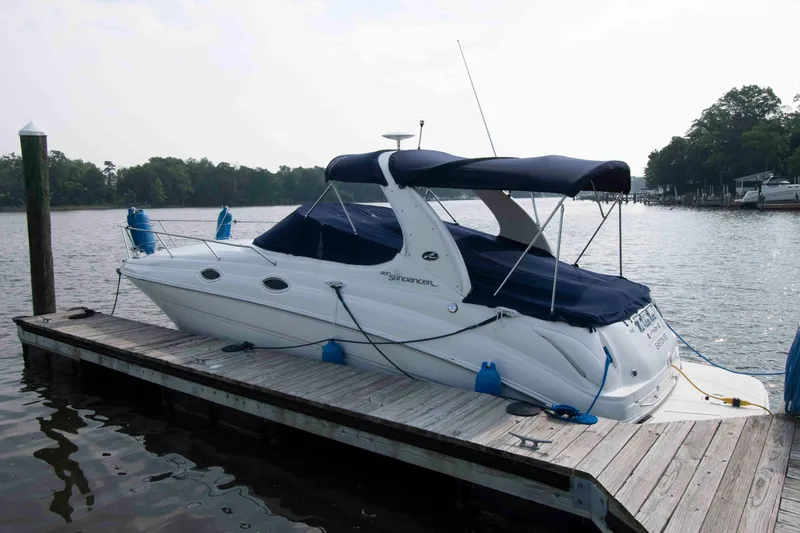 The Image of 2007 Sea Ray 280 Sundancer docked at a serene lakeside pier. - 0
