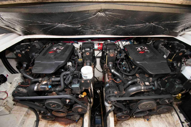 Slide: The Image of Engine compartment of a 2007 Sea Ray 280 Sundancer boat, featuring dual engines. - 15