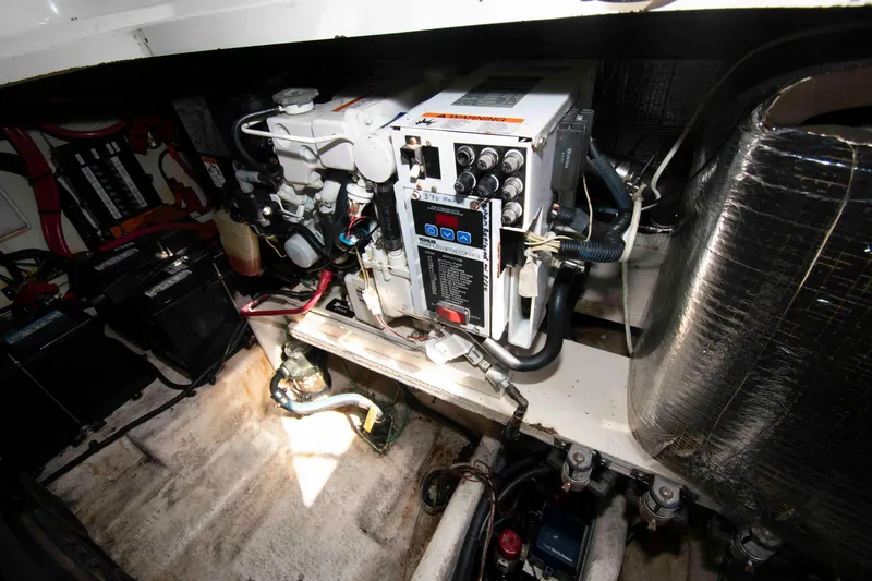 Slide: The Image of Engine compartment of a 2007 Sea Ray 280 Sundancer boat, showcasing mechanical components. - 16