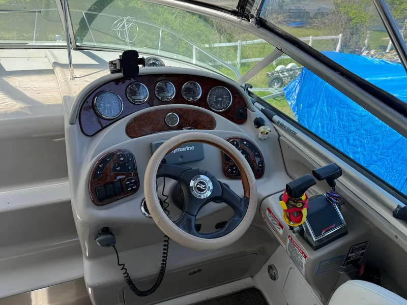 Slide: The Image of 2007 Sea Ray 280 Sundancer boat dashboard with steering wheel and instrument panel. - 8