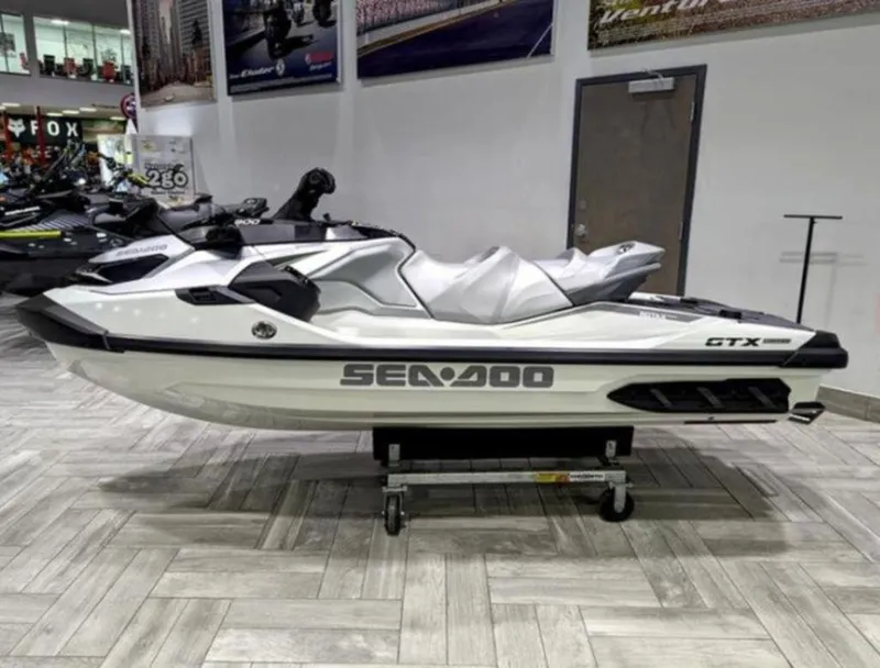 Slide: The Image of 2025 Sea-Doo GTX™ Limited 325 White Pearl Premium jet ski displayed indoors. - 3