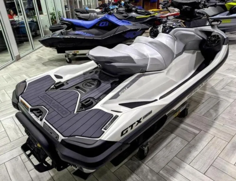 Slide: The Image of 2025 Sea-Doo GTX™ Limited 325 in White Pearl Premium, displayed in a showroom. - 4