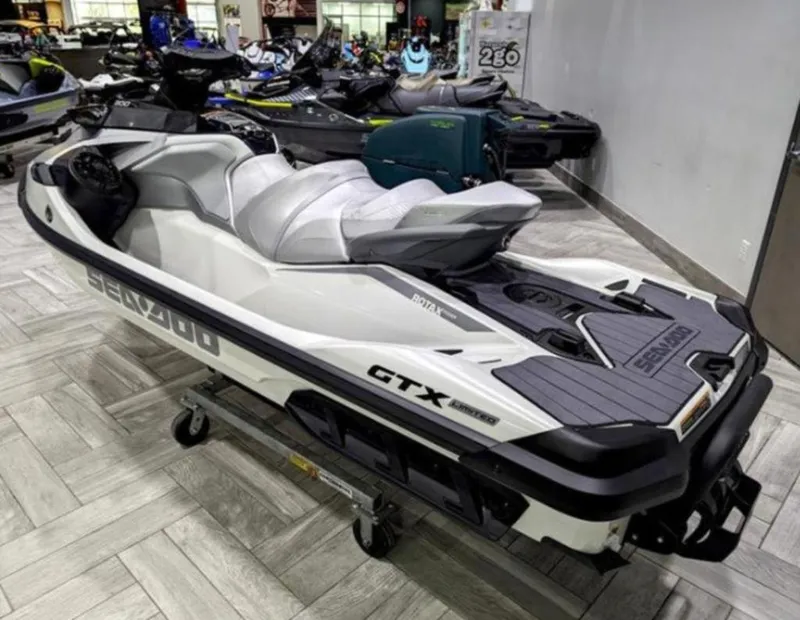 Slide: The Image of 2025 Sea-Doo GTX™ Limited 325 White Pearl Premium jet ski displayed in showroom. - 6