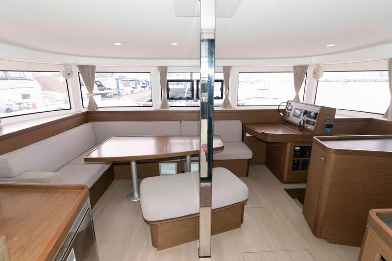 Slide: The Image of Interior of 2019 Lagoon 42 yacht with modern seating and navigation area. - 24