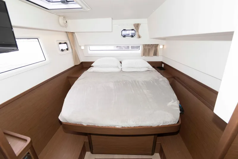 Slide: The Image of Luxurious cabin interior of 2019 Lagoon 42 catamaran with cozy double bed. - 30
