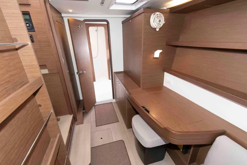 Slide: The Image of Interior of 2019 Lagoon 42 yacht with wooden desk and shelves. - 31
