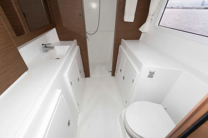 Slide: The Image of Modern bathroom interior of 2019 Lagoon 42 yacht with shower, sink, and toilet. - 33