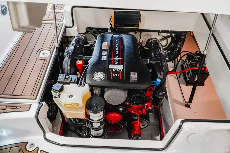 Slide: The Image of 2013 Cobalt A28 boat engine compartment with a 350 V8 motor, showcasing detailed components. - 16