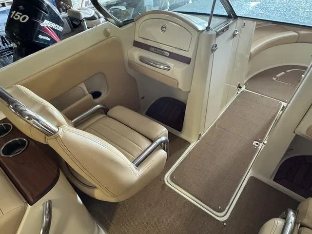 Slide: The Image of 2012 Chris-Craft Launch 28 interior with beige seating and wood accents. - 13