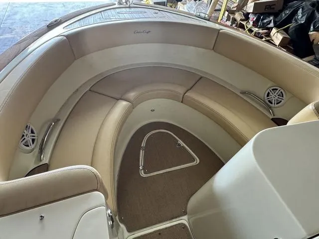 Slide: The Image of 2012 Chris-Craft Launch 28 boat interior with beige seating and carpeted floor. - 15