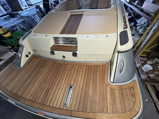 Slide: The Image of 2012 Chris-Craft Launch 28 boat with teak deck and beige seating in a storage area. - 6