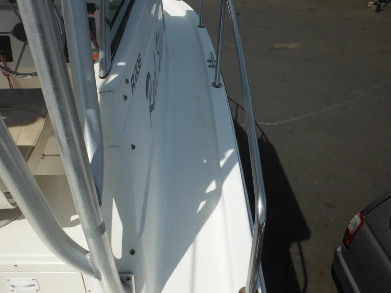 Slide: The Image of 2002 Robalo R235 Walkaround boat deck with railing, viewed from above. - 18