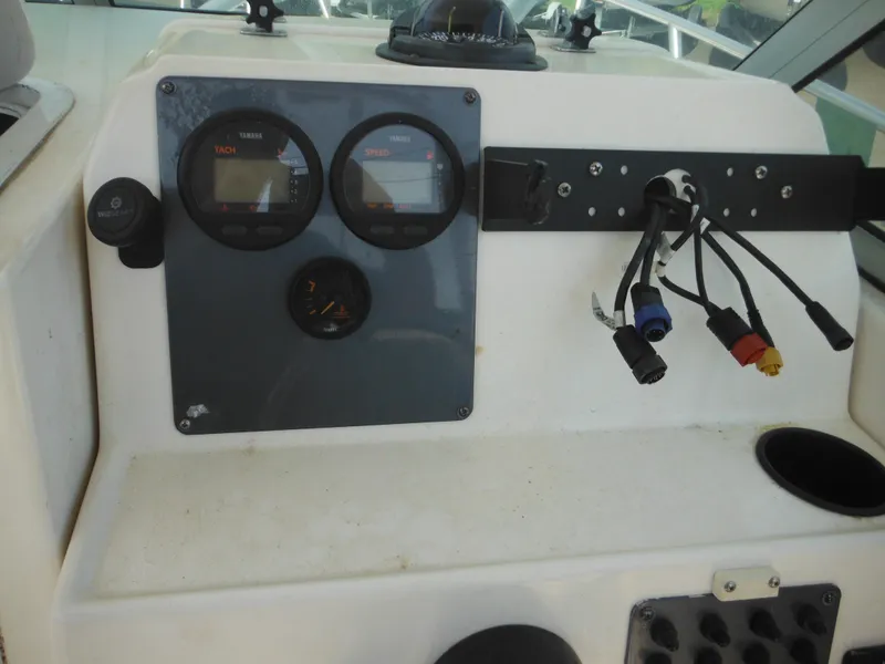Slide: The Image of Dashboard of a 2002 Robalo R235 Walkaround boat with gauges and wiring. - 26