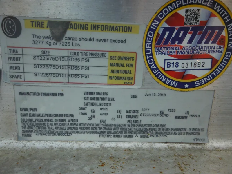 Slide: The Image of Tire loading information label on a 2002 Robalo R235 Walkaround boat trailer. - 3