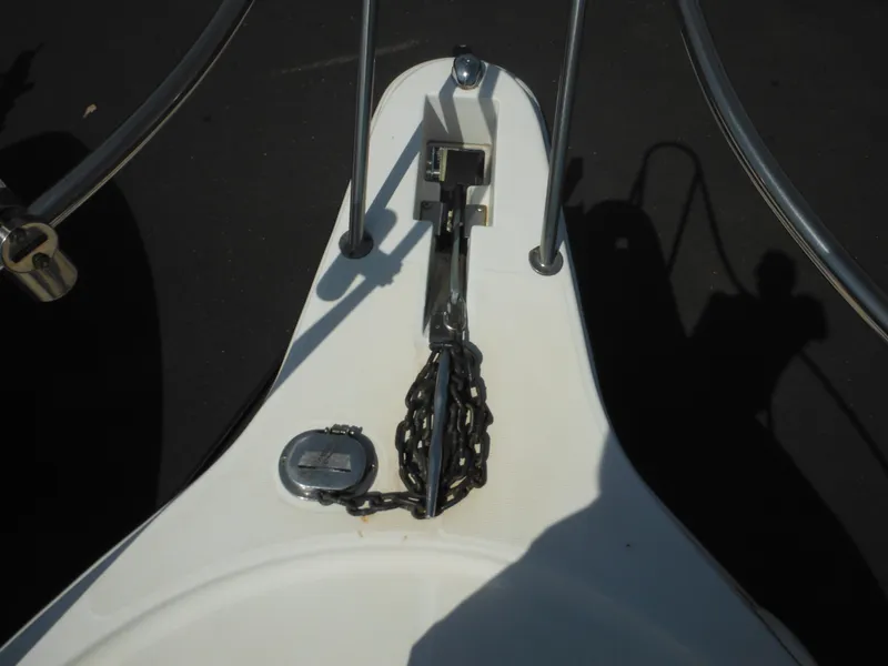 Slide: The Image of Bow of 2002 Robalo R235 Walkaround with anchor chain and railing. - 39