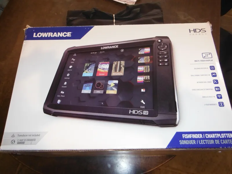 Slide: The Image of Lowrance HDS-12 fishfinder/chartplotter box on table, compatible with 2002 Robalo R235 Walkaround. - 48