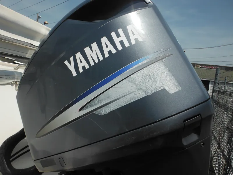 Slide: The Image of Yamaha outboard motor on a 2002 Robalo R235 Walkaround boat. - 8